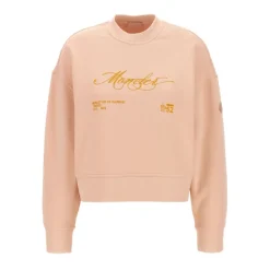Różowy sweter z haftowanym logo